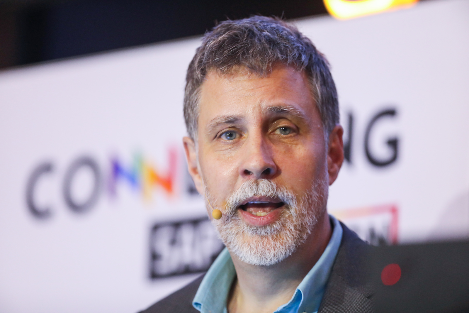 Lloyd Keays speaking at conference